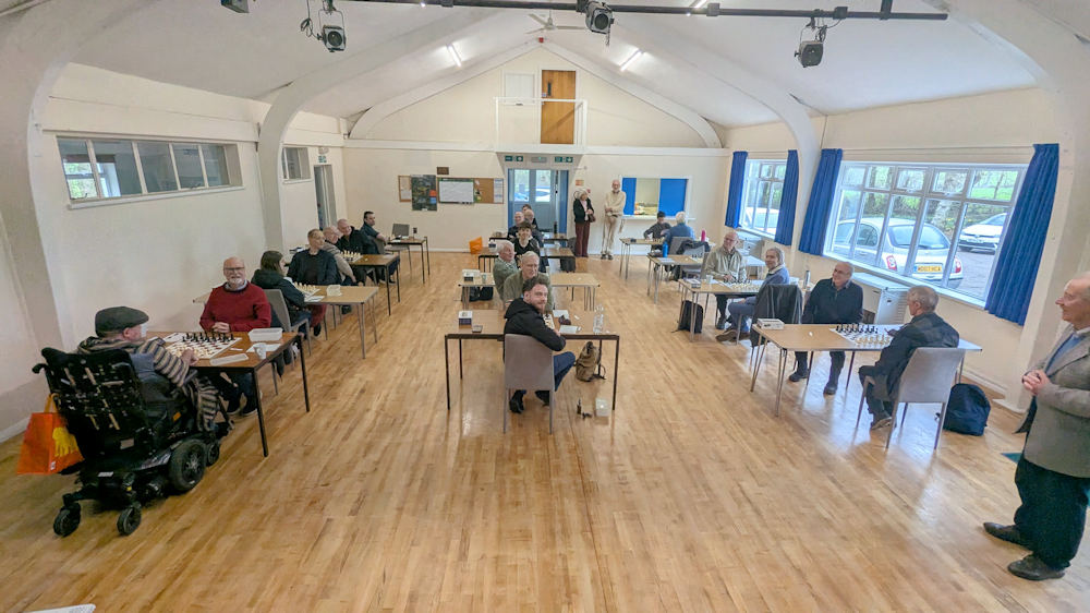 A hall full of people ready to start playing chess